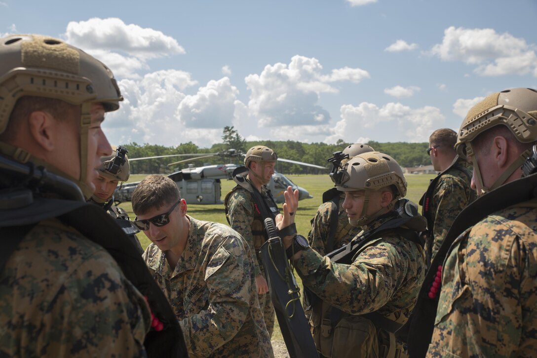 U.S. Marines from Echo Company, 4th Reconnaissance Battalion, 4th Marine Division, Marines Forces Reserve, pull their combat rubber raiding craft from Lake Margrethe, at Camp Grayling Joint Maneuver Training Center, Michigan, during exercise Northern Strike 2017, July 31, 2017.