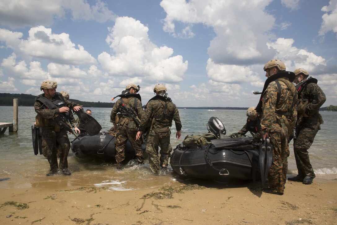 U.S. Marines from Echo Company, 4th Reconnaissance Battalion, 4th Marine Division, Marines Forces Reserve, pull their combat rubber raiding craft from Lake Margrethe, at Camp Grayling Joint Maneuver Training Center, Michigan, during exercise Northern Strike 2017, July 31, 2017.