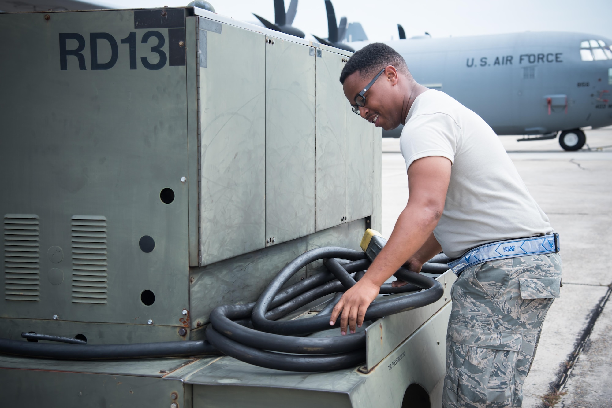 Senior Airman Fadarious Woods, 913th Maintenance Squadron crew chief from Little Rock Air Force Base, Arkansas, returns a power cord to its proper place on a generator july 21, 2017 at Keesler AFB, Mississippi. (U.S. Air Force photo/Staff Sgt. Heather Heiney)