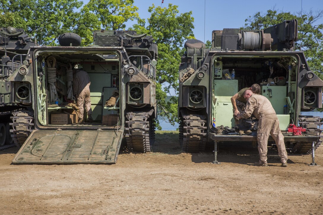 U.S. Marines from Echo Company, 4th Reconnaissance Battalion, 4th Marine Division, Marines Forces Reserve, pull their combat rubber raiding craft from Lake Margrethe, at Camp Grayling Joint Maneuver Training Center, Michigan, during exercise Northern Strike 2017, July 31, 2017.