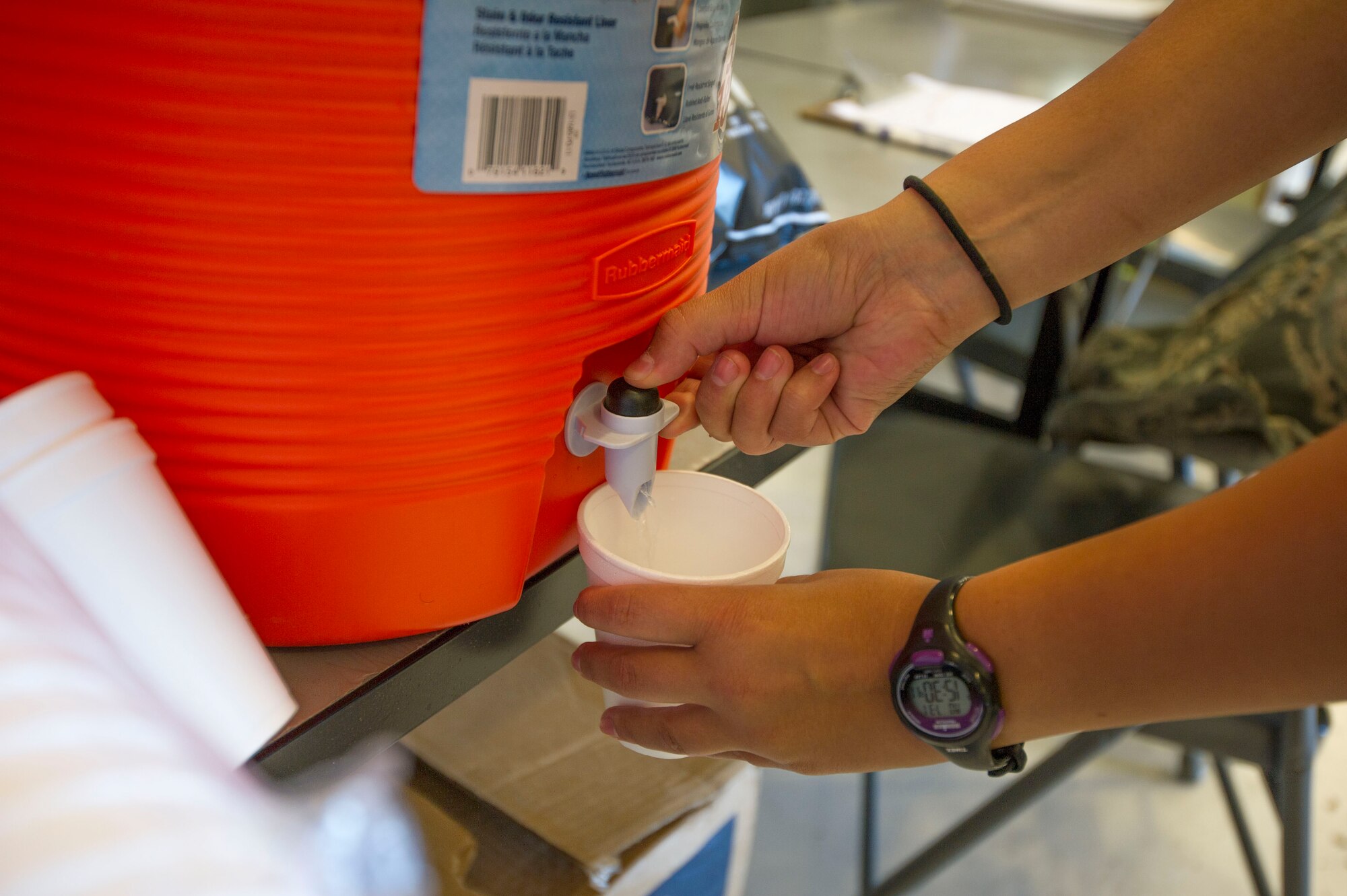 An Airmen fills a cup of ice water during the the Mobility Guardian exercise on Joint Base Lewis-McChord, Aug. 1. Military personnel from around the nation and world particiapting in Mobility Guardian will need to stay hydrated and well rested to combat an intense heat wave set to hit during the first week of the exercise.