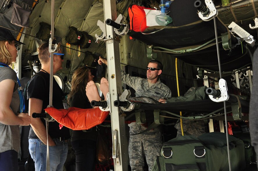 PETERSON AIR FORCE BASE, Colo. -- Senior Master Sgt. Gary Taiclet, the 34th Aeromedical Evacuation Squadron superintendent, explains the mission of his squadron to representatives of various entertainment offices out of Los Angeles on board a 302nd Airlift Wing C-130 Hercules at Peterson Air Force Base, Colo., July 18, 2017. The entertainment representatives toured bases in the Pikes Peak Region to see the vital role the Air Force Space Command and Air Force Reserve Command play in the nation’s defense and encourage Air Force storytelling in the entertainment industry. (U.S. Air Force photo/Staff Sgt. Frank Casciotta)