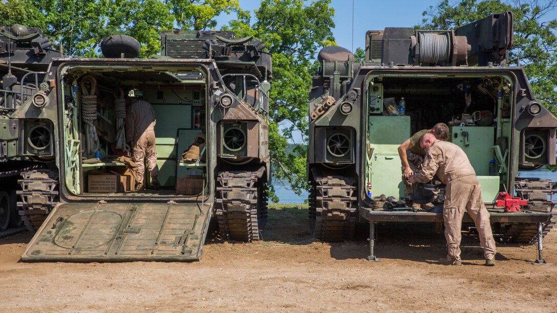 U.S. Marines with Bravo Company, 4th Amphibious Assault Battalion, 4th Marine Division, Marine Forces Reserve, work on Amphibious Assault Vehicles at Camp Grayling, Michigan, during exercise Northern Strike 2017, July 31, 2017. Northern Strike 2017 brought together Reserve Marine from across the country to provide realistic combined arms trainings to cover a spectrum of combat scenarios.