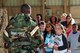 U.S. Air Force Staff Sgt. Wendell Walker, 20th Force Support Squadron (FSS) unit deployment manger, speaks to children about individual protective equipment during a Kids Meet the Shaw Weasels event at Shaw Air Force, S.C., July 28, 2017. The 20th FSS Airman and Family Readiness Center event was intended to provide children a fun and educational experience to help them understand what military members do. (U.S. Air Force photo by Airman 1st Class Kathryn R.C. Reaves)