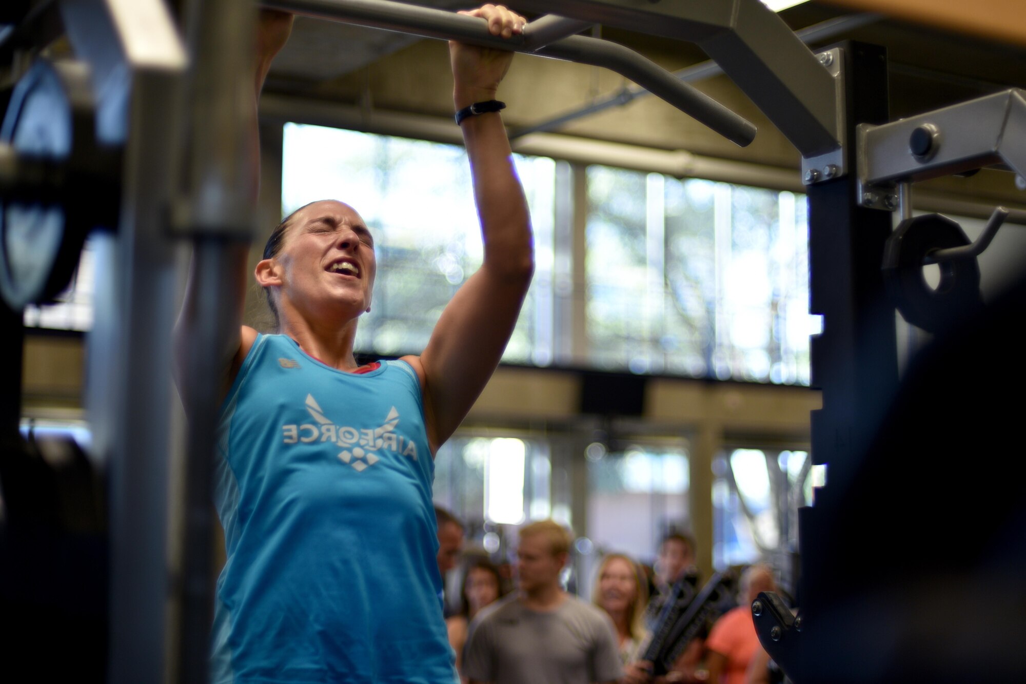 U.S. Air Force Master Sgt. Jennifer Negley, 316th Training Squadron Flight Chief, performs a pull-up during San Angelo Special Ops Challenge in the Ben Kelly Center for Human Performance in San Angelo, Texas, July 29, 2017. Participants must complete at least six pull-ups in under two minutes to qualify for special operations. (U.S. Air Force photo by Airman 1st Class Randall Moose/Released)