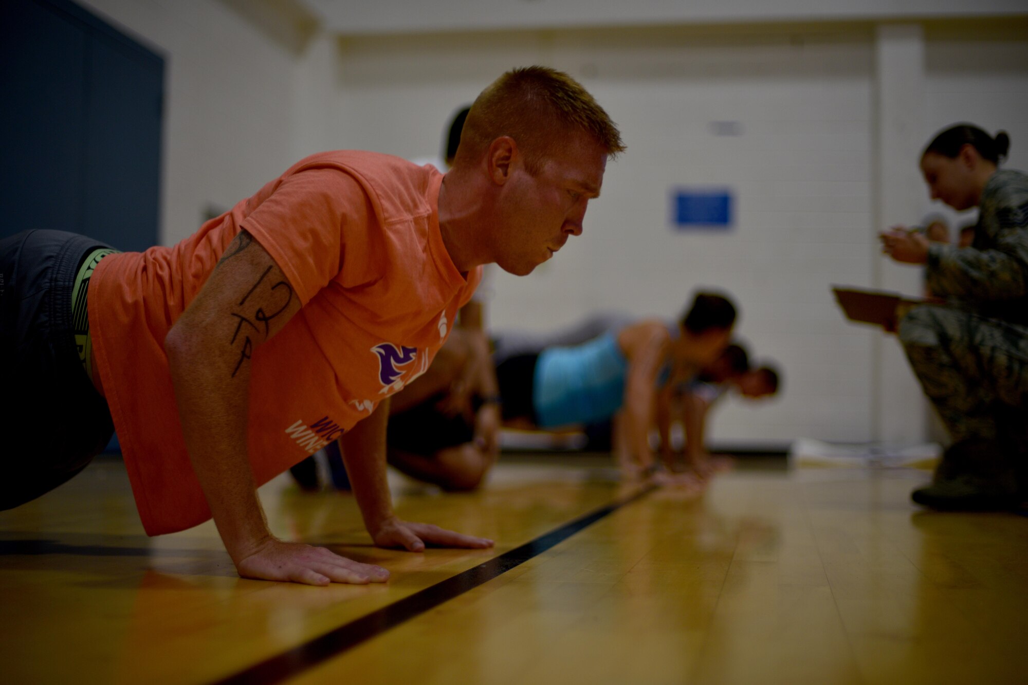 U.S. Air Force Tech Sgt. Derek Gammel, 312th Training Squadron flight chief, performs push-ups during San Angelo Special Ops Challenge in the Ben Kelly Center for Human Performance in San Angelo, Texas, July 29, 2017. Participants must complete at least 35 push-ups in under two minutes to qualify for special operations. (U.S. Air Force photo by Airman 1st Class Randall Moose /Released)