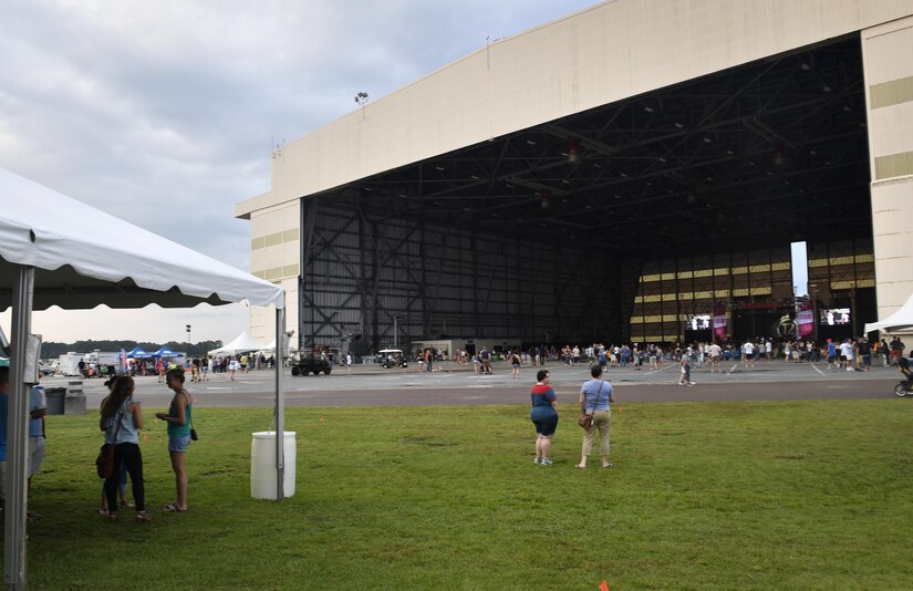 Attendees of Music Fest 2017 gather inside a hangar on the air base here July 29.
