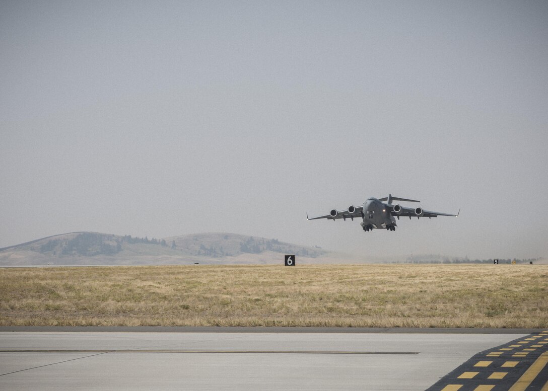 A C-17 Globemaster III takes off to join Mobility Guardian exercises Aug. 2, 2017, at Fairchild Air Force Base, Washington. The Globemaster III is commonly used for tactical and strategic airlift missions, transporting troops and cargo throughout the world. (U.S. Air Force photo / Airman 1st Class Ryan Lackey)