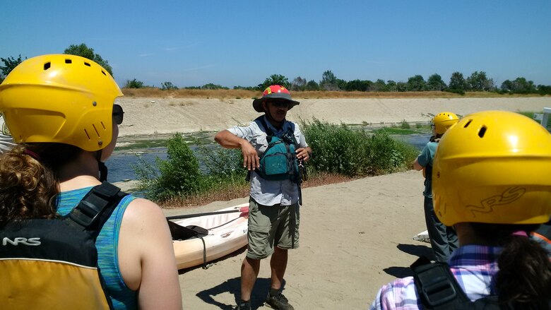 Mountains Recreation and Conservation Authority Ranger Fernando Gomez prepares Planning Associates for a kayaking tour of the Los Angeles River at Sepulveda Basin, Encino, California, July 20. The associates were students of the Watershed Planning course that covered Integrated Water Resources Management principles, Corps watershed planning steps and stakeholder perspectives, with the Los Angeles River serving as the case study.