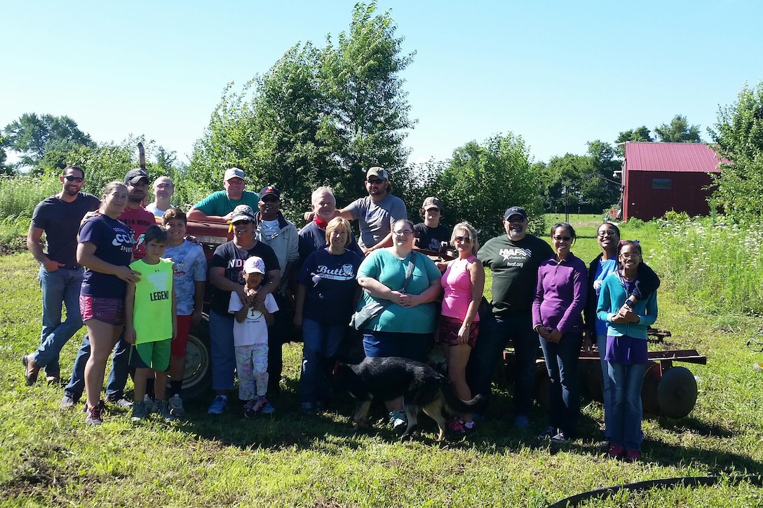 Volunteers pose for a group photo.