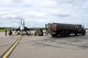 A Royal Canadian Air Force CF-18 Hornet fighter aircraft assigned to the 425th Tactical Fighter Squadron, Canadian Forces Base, Bagotville, Canada, sits on the Eielson Air Force Base, Alaska, flight line while a U.S. Air Force fuel truck with the 354th Logistics Readiness Squadron is preparing to refuel the aircraft Aug. 1, 2017, during RED FLAG-Alaska (RF-A) 17-3. RF-A provides an optimal training environment in the Indo-Asia-Pacific Region and focuses on improving ground, space, and cyberspace combat readiness and interoperability for U.S. and international forces. (U.S. Air Force photo by Senior Airman Cassie Whitman)