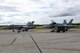 Two Royal Canadian Air Force CF-18 Hornet fighter aircraft assigned to the 425th Tactical Fighter Squadron from Canadian Forces Base, Bagotville, Canada, sit on the Eielson Air Force Base, Alaska, runway while two Canadian airmen work in the cockpit Aug. 1, 2017, during RED FLAG-Alaska (RF-A) 17-3. RF-A exercises provide realistic combat training, which is essential to the success of air and space operations. (U.S. Air Force photo by Senior Airman Cassie Whitman)