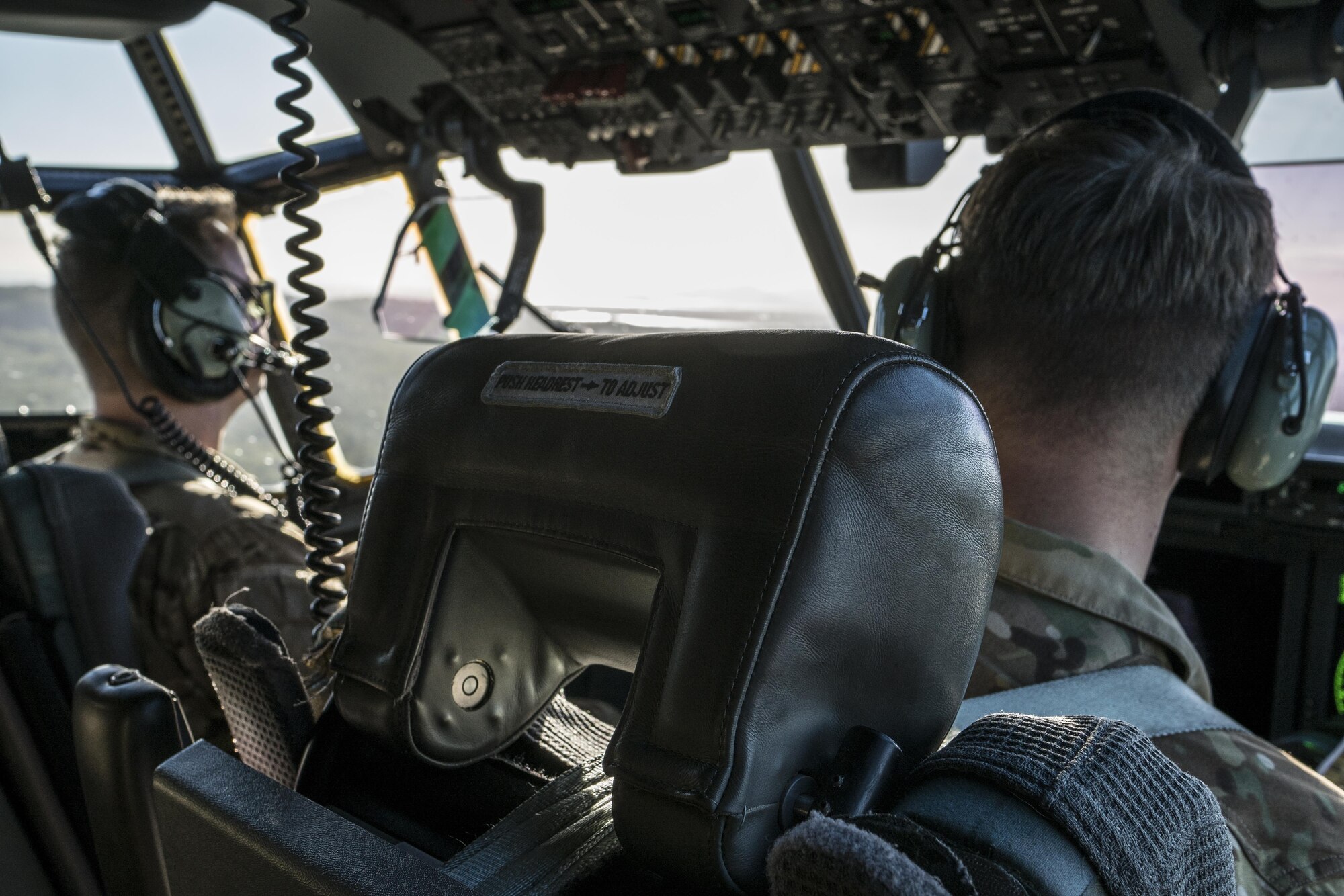 U.S. Air Force 17th Special Operations Squadron pilots looks out the window of a U.S. Air Force MC-130J Commando II during a dissimilar formation flight with No. 40 Squadron Royal New Zealand Air Force July 12, 2017, over Queensland, Australia. Executing airborne operations throughout Talisman Saber 2017, the bilateral training event symbolized the strength of a partnership that has evolved over the years. (U.S. Air Force photo by Capt. Jessica Tait)