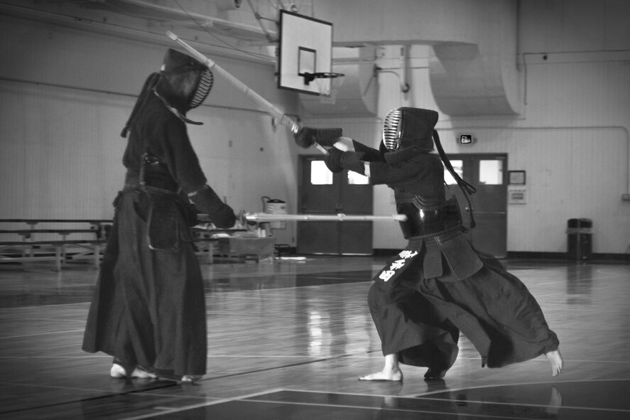 Kendo practitioners strike each other during the Kendo Club Joint Summer Camp at Yokota Air Base, Japan, July 29, 2017.