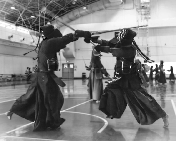 A kendo practitioner strikes his opponent’s head during the Kendo Club Joint Summer Camp at Yokota Air Base, Japan, July 29, 2017. Yokota Kendo Club has practiced every Saturday for about 25 years.