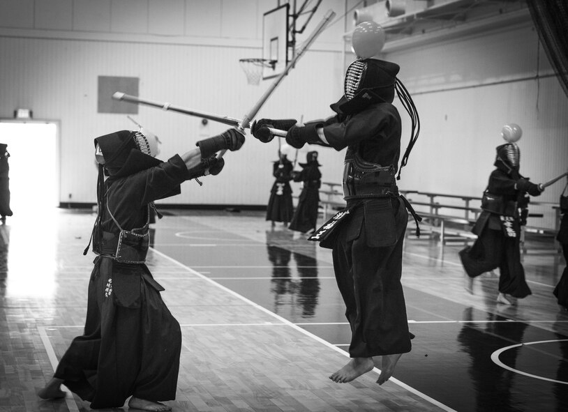 A kendo practitioner attempts to pop a balloon with a shinai with jumping during balloon battle at Yokota Air Base, Japan, July 29, 2017.