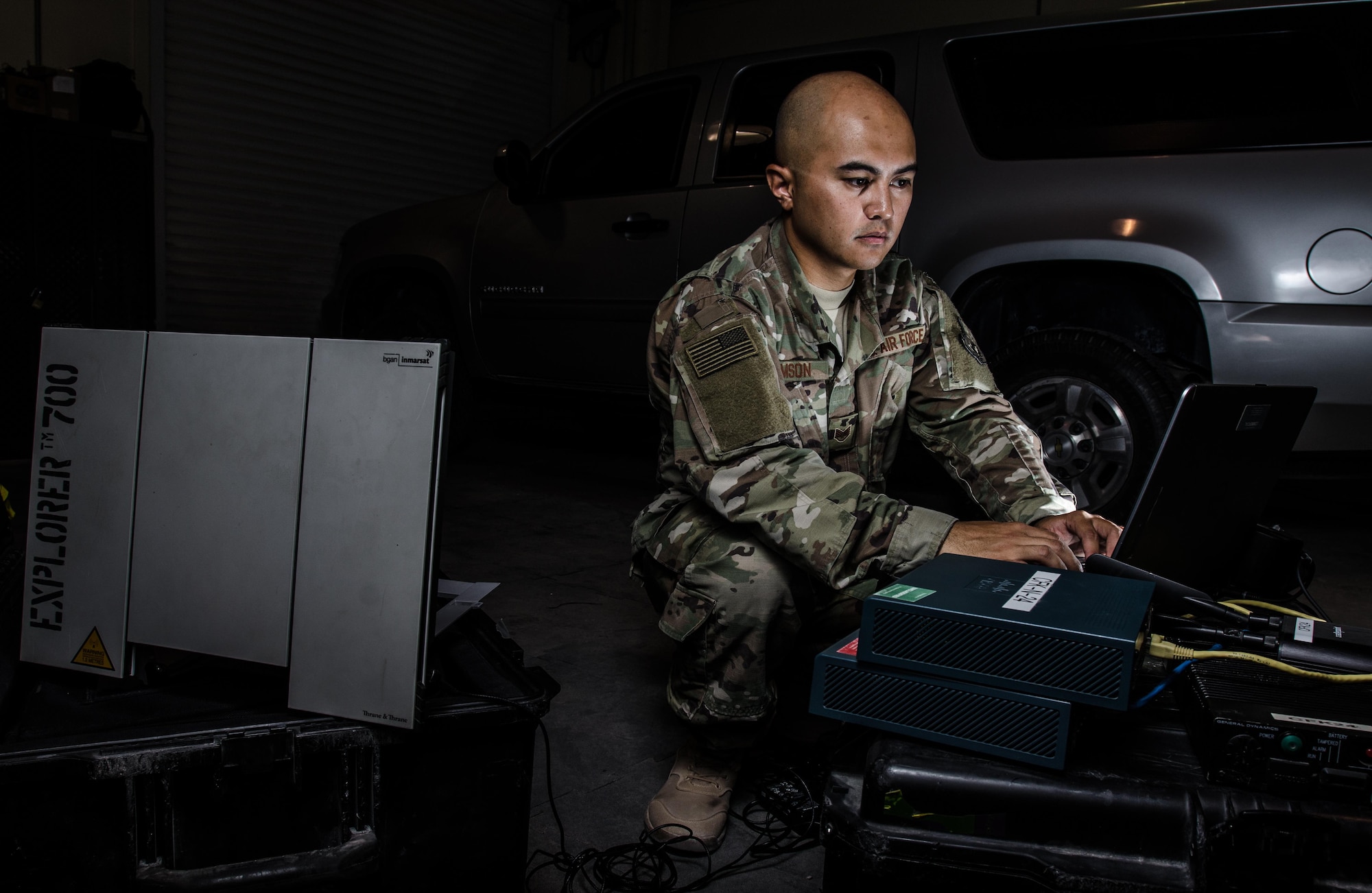 U.S. Air Force Staff Sgt. Junbryan Samson, a cyber network technician assigned to the U.S. Air Forces Central Command communications division at the Combined Air Operations Center, tests a communications fly-away kit July 31, 2017, at Al Udeid Air Base, Qatar. Samson ensures the CFK is maintained and ready to deploy at a moments notice to bases around the AFCENT region to create command and control network connections. (U.S. Air Force photo by Staff Sgt. Alexander W. Riedel)