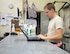 U.S Air Force Airman 1st Class Cody Maddux, a guidance and control technician with the 763rd Expeditionary Aircraft Maintenance Unit, prepares a computer with all the required RC-135V/W Rivet Joint checklist at Al Udeid Air Base, Qatar, July 27, 2017.  Maddux is responsible for keeping the RC-135V/W Rivet Joint operational so it can provide near real time on-scene intelligence collection and analysis throughout the U.S. Air Forces Central Command area of responsibility. (U.S. Air Force photo by Tech. Sgt. Amy M. Lovgren)