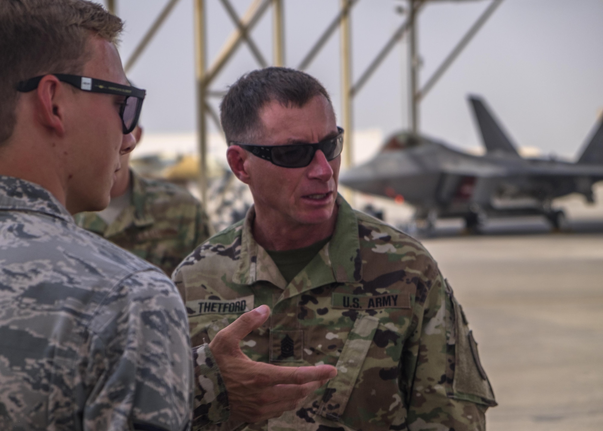 Command Sgt. Maj. William F. Thetford meets with 380th Air Expeditionary Wing Airmen July 26, 2017, at Al Dhafra Air Base, United Arab Emirates.