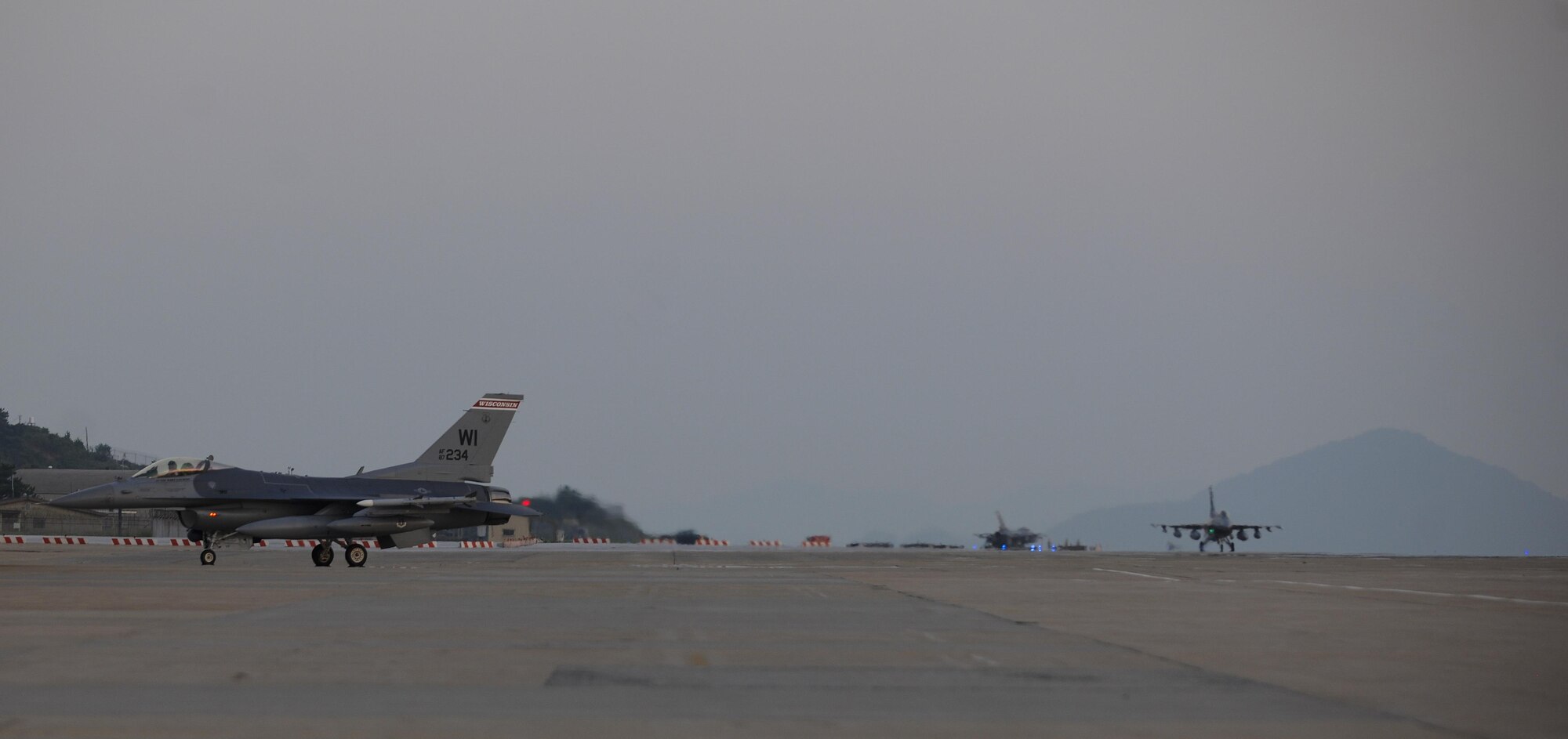 Three F-16 Fighting Falcons, or more commonly known as Vipers, assigned to the 176th Fighter Squadron, 115th Fighter Wing, Wisconsin Air National Guard taxi at Kunsan Air Base, Republic of Korea, Aug. 8, 2017.