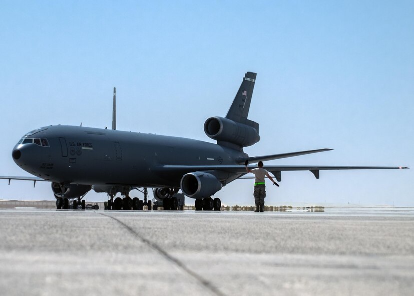 Tech. Sgt. Javier, 380th Aircraft Maintenance Squadron Extender Aircraft Maintenance Unit crew chief, marshals a KC-10 Extender August 3, 2017, at Al Dhafra Air Base, United Arab Emirates.