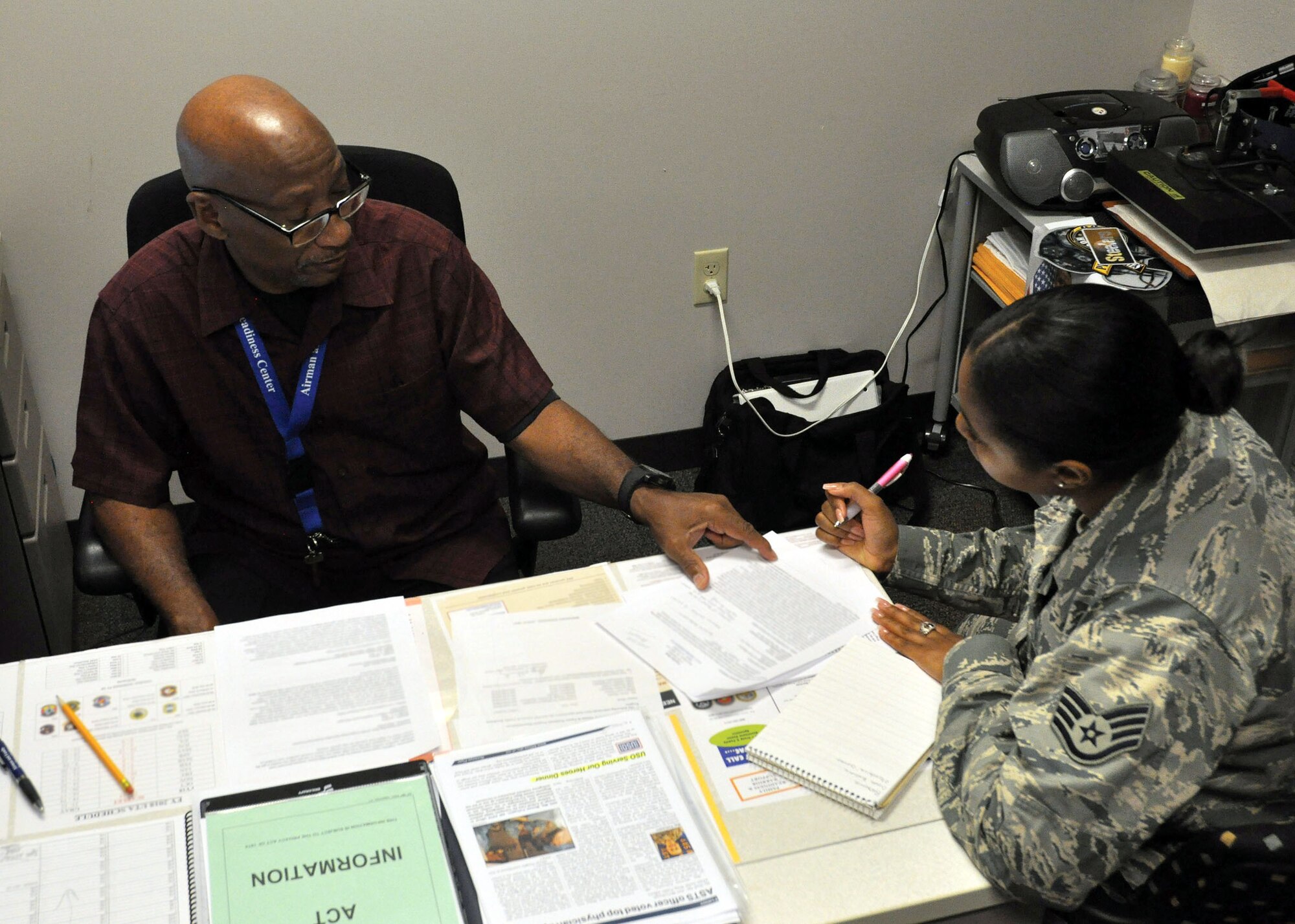 Mr. Alvin Dennis, 445th Airlift Wing Airman and Family Readiness Center community readiness consultant, assists Staff Sgt. Taneisha Bush, 445 AW commander support staff administrative craftsman, with her resume July 20, 2017 at the Airman and Family Readiness Center. (U.S. Air Force photo/Airman 1st Class Ethan Spickler)
