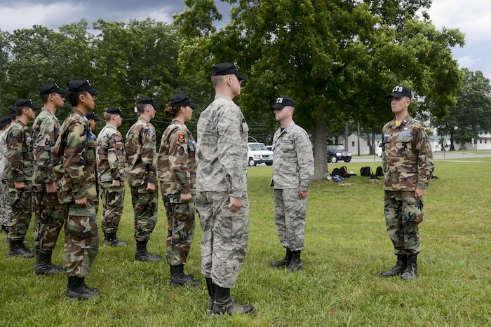 Airmen inspect a cadet formation.