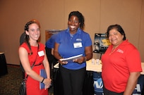 Tiffany Owens - employee of the Readiness & Training Systems Department at the Naval Surface Warfare Center Dahlgren Division (NSWCDD) - discusses career opportunities with a candidate at an NSWCDD job fair. The command's Human Resources Division announced Aug. 2 that it plans to make about 100 tentative job offers to candidates who attended the event. Approximately 325 candidates with bachelor's, master's, and doctoral degrees in biology, chemistry, computer science, engineering, mathematics, and physics spoke with senior Navy scientists, engineers, and managers about positions available for entry-level and experienced scientists and engineers.