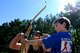 Marc Galbraith, 786th Force Support Squadron archery course instructor, instructs Ian, son of Tech. Sgt. Thomas Gentry, 603rd Air Operations Center air and air defense noncommissioned officer in charge, during an Introduction to Archery course at the Kaiserslautern Rod & Gun Club on Vogelweh Military Complex, July 29, 2017. The course is open to all age groups once a month and doesn’t require any experience. (U.S. Air Force photo by Airman 1st Class Savannah L. Waters)