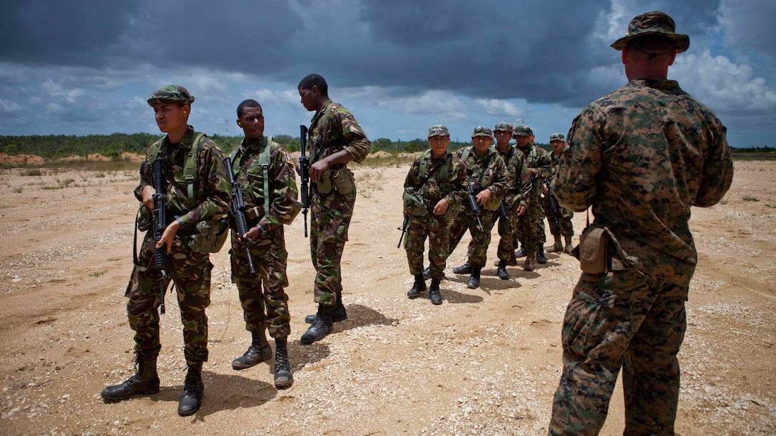U.S. Marine Sgt. Dustin J. Houghton, an infantry trainer with the Belize Detachment, Ground Combat Element, Special Purpose Marine Air-Ground Task Force - Southern Command, trains service members with the Belize Defence Force in basic combat marksmanship near Ladyville, Belize, July 20, 2017. The training was part of basic infantry skills course taught by the detachment to members of the BDF. The Marines and sailors of SPMAGTF-SC are deployed to Central America from June to November 2017 to conduct security cooperation training and engineering projects with their counterparts in Belize, El Salvador, Guatemala, and Honduras.