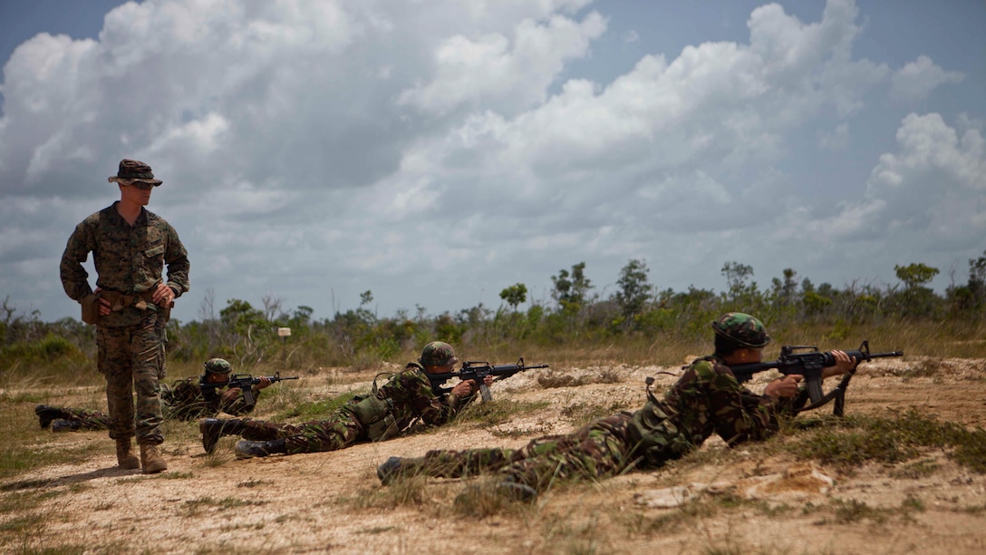 U.S. Marine Sgt. Cameron J. Earhart, an infantry trainer with the Belize Detachment, Ground Combat Element, Special Purpose Marine Air-Ground Task Force - Southern Command, trains service members with the Belize Defence Force in basic combat marksmanship near Ladyville, Belize, July 20, 2017. The training was part of basic infantry skills course taught by the detachment to members of the BDF. The Marines and sailors of SPMAGTF-SC are deployed to Central America from June to November 2017 to conduct security cooperation training and engineering projects with their counterparts in Belize, El Salvador, Guatemala, and Honduras.