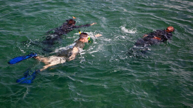 U.S. Marine Sgt. David G. Gaudette II, the detachment staff noncommissioned officer in charge of the Honduras Detachment, Ground Combat Element, Special Purpose Marine Air-Ground Task Force - Southern Command, trains Honduran marines in basic water survival skills in Trujillo, Honduras, July 26, 2017. The training was part of a basic infantry skills course for Honduran marines. The Marines and sailors of SPMAGTF-SC are deployed to Central America from June to November 2017 to conduct security cooperation training and engineering projects with their counterparts in Belize, El Salvador, Guatemala, and Honduras.