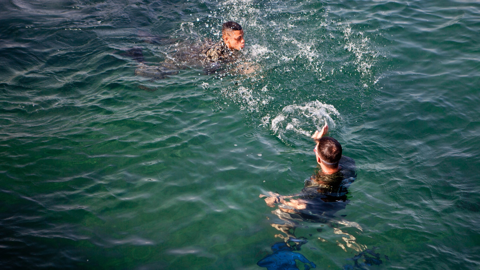 U.S. Marine Sgt. David G. Gaudette II, the detachment staff noncommissioned officer in charge of the Honduras Detachment, Ground Combat Element, Special Purpose Marine Air-Ground Task Force - Southern Command, trains Honduran marines in basic water survival skills in Trujillo, Honduras, July 26, 2017. The training was part of a basic infantry skills course for Honduran marines. The Marines and sailors of SPMAGTF-SC are deployed to Central America from June to November 2017 to conduct security cooperation training and engineering projects with their counterparts in Belize, El Salvador, Guatemala, and Honduras.