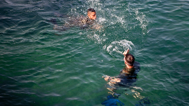 U.S. Marine Sgt. David G. Gaudette II, the detachment staff noncommissioned officer in charge of the Honduras Detachment, Ground Combat Element, Special Purpose Marine Air-Ground Task Force - Southern Command, trains Honduran marines in basic water survival skills in Trujillo, Honduras, July 26, 2017. The training was part of a basic infantry skills course for Honduran marines. The Marines and sailors of SPMAGTF-SC are deployed to Central America from June to November 2017 to conduct security cooperation training and engineering projects with their counterparts in Belize, El Salvador, Guatemala, and Honduras.