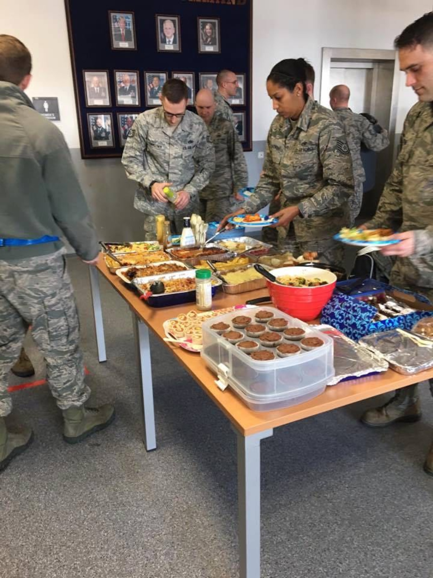 Airmen assigned to the 721st Aircraft Maintenance Squadron prepare plates during an Airmen Appreciation Dinner.