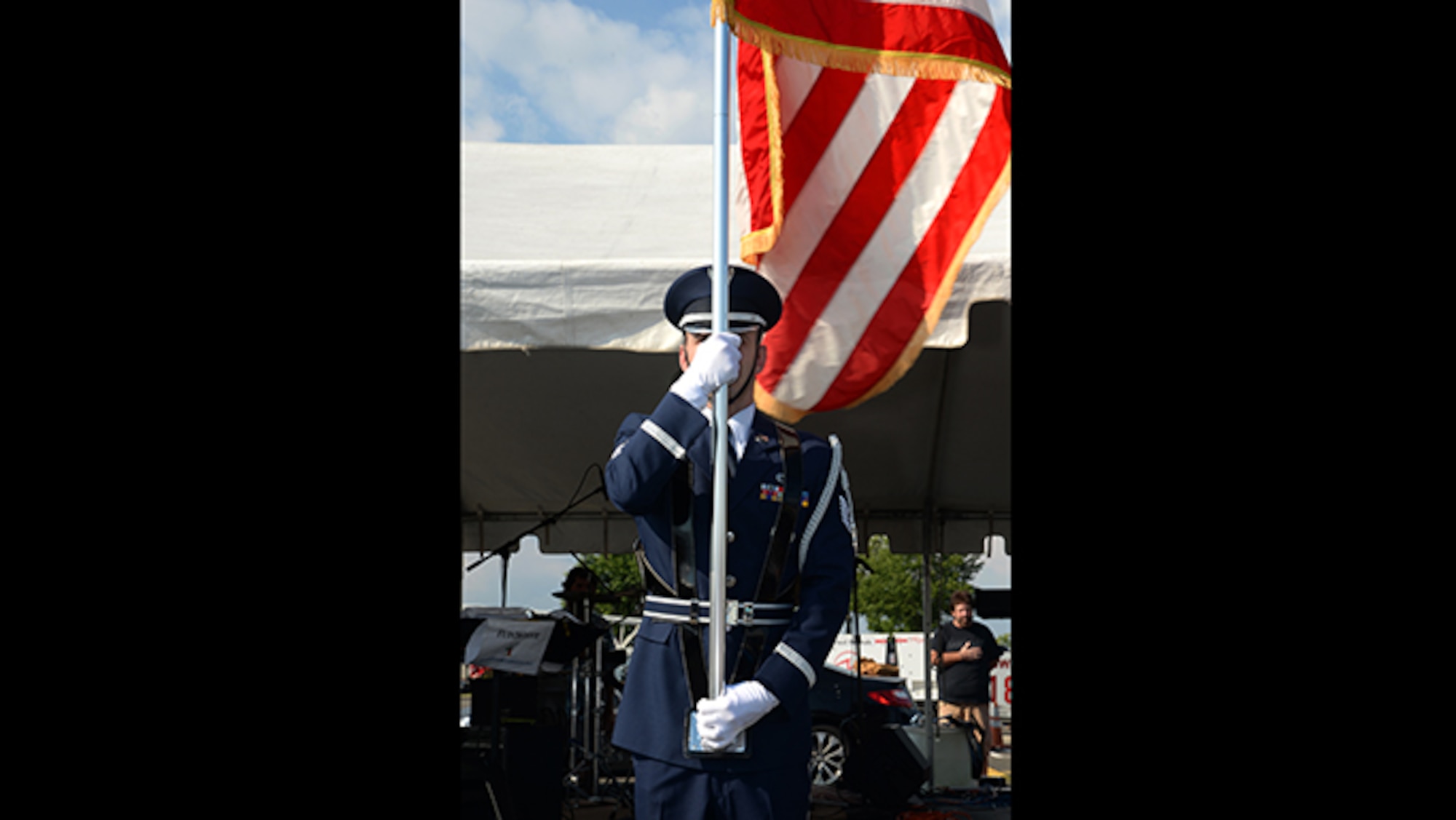 A picture of U.S. Air Force Tech. Sgt. Jonathan D. Kane, a 177th Fighter Wing Honor Guard Member, displaying the colors.