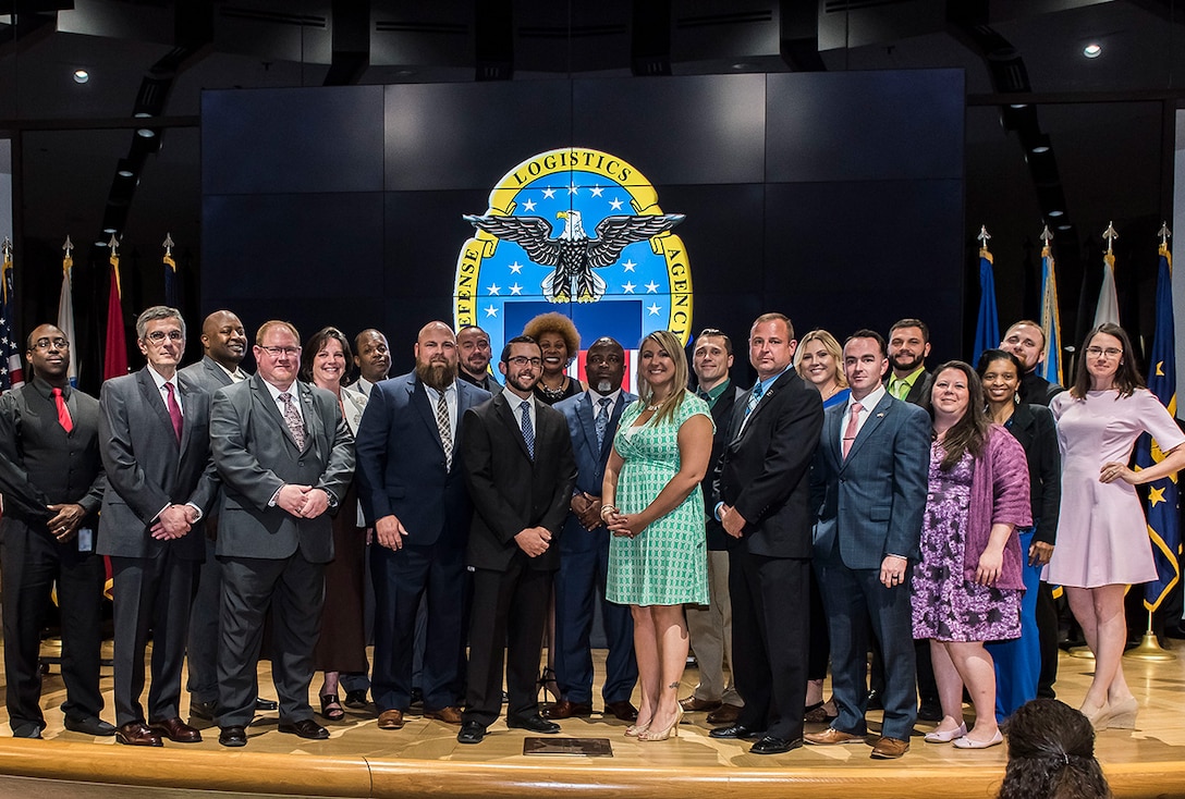 DLA PaCE graduates pose for photo.