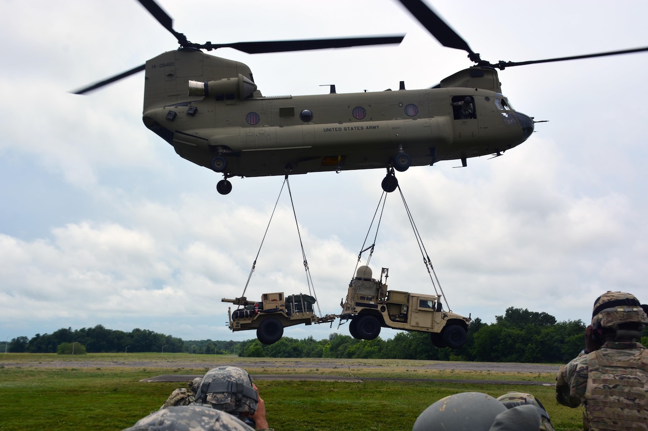 Helicopter lifting vehicle and weapon trailer
