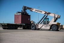 A Hyster 100k Reach Stacker loads equipment at Holloman Air Force Base N.M., July 28, 2017, to be delivered by members of Army’s 424th Transportation Company to be used during Patriot Warrior at Fort McCoy, Wis. Patriot Warrior is a joint field training exercise that replicates all aspects of combat medical service support, and without the cargo provided by Holloman and the delivery made by Army’s 424th Transportation Company Patriot Warrior could not happen. (U.S. Air Force photo by Senior Airman Chase Cannon)