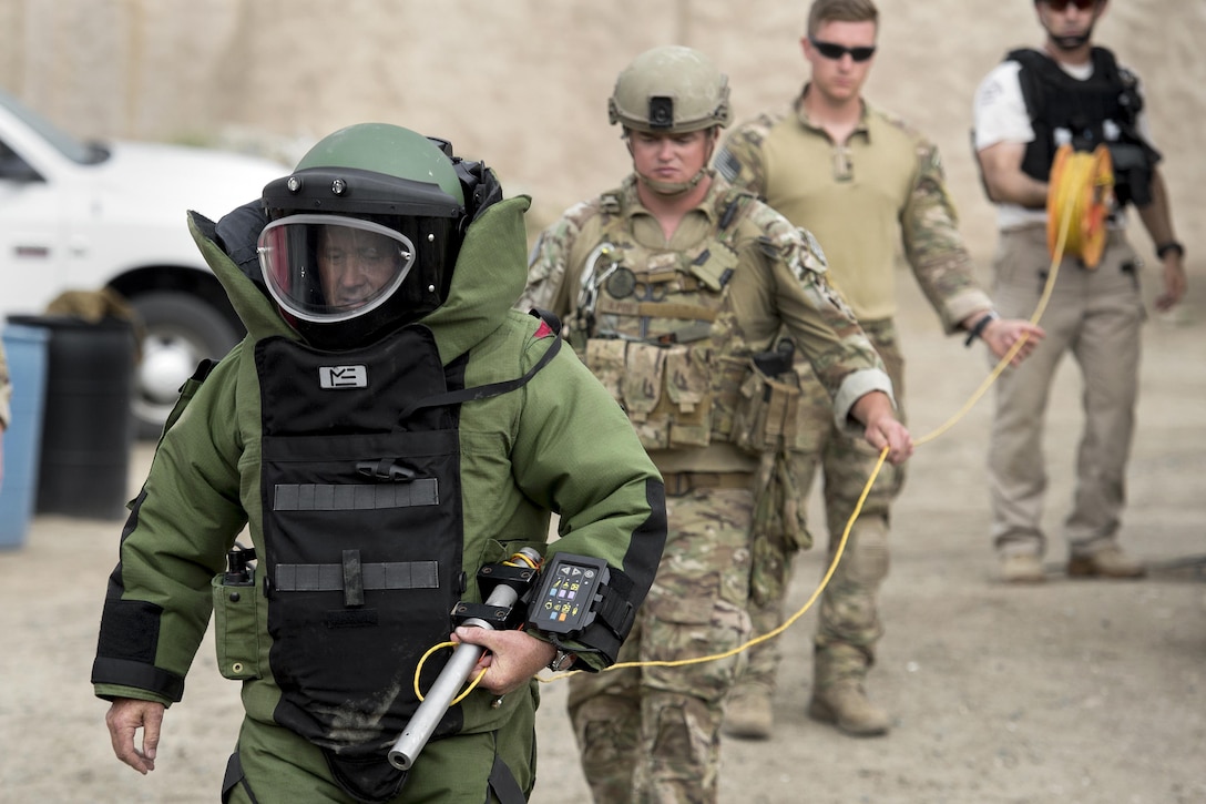A bomb disposal team takes part in a training exercise.