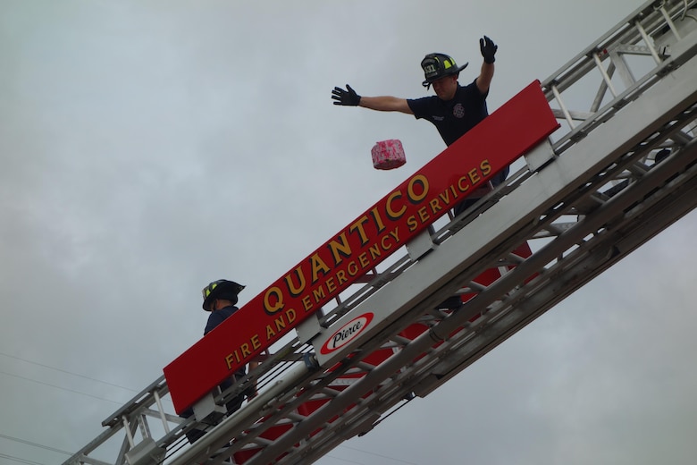 During the seventh annual STEM camp at Quantico Middle / High School, students developed  balloons filled with oatmeal, water, and red dye to simulate the brain, and had to develop a structure to protect the “balloon brains” from concussion.  The activity culminated in a competition where students dropped their balloon brains from the ladder of a fire truck supplied by the Quantico Fire Department. Three balloon brains tied for honors, surviving drops up to 21 feet. (Courtesy photo)