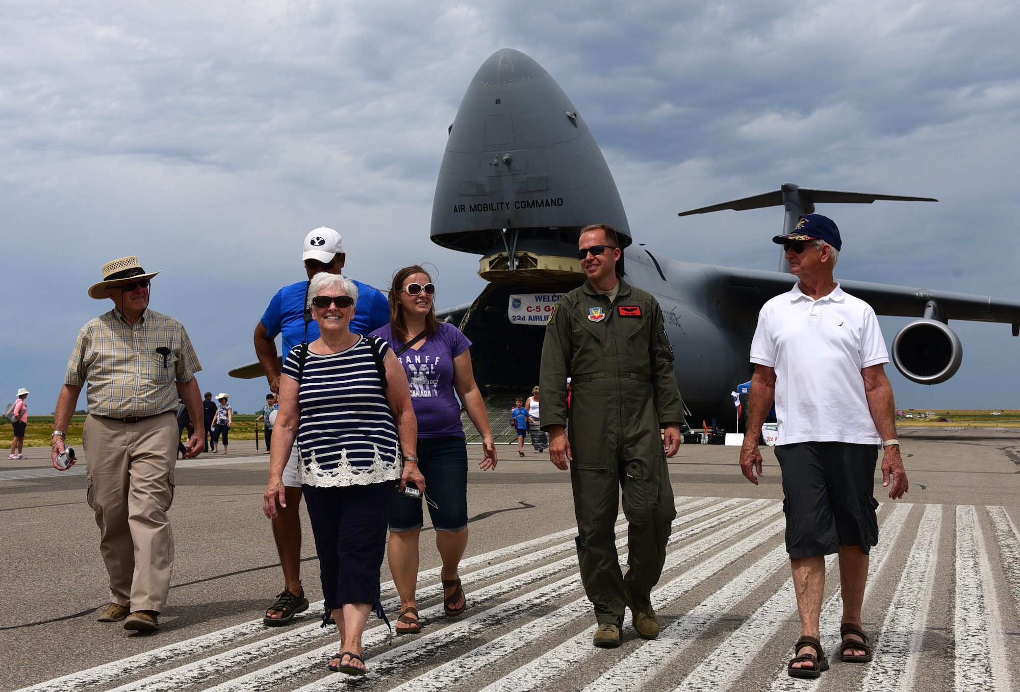 Maj. Richard, 432nd Wing MQ-1 Predator pilot, walks toward the Lethbridge International Airshow July 15, 2017, in Alberta, Canada. Richard grew up near Lethbridge for 15 years and learned his love for aviation at the airshow nearly 30 years ago. (U.S. Air Force photo/Senior Airman Christian Clausen)
