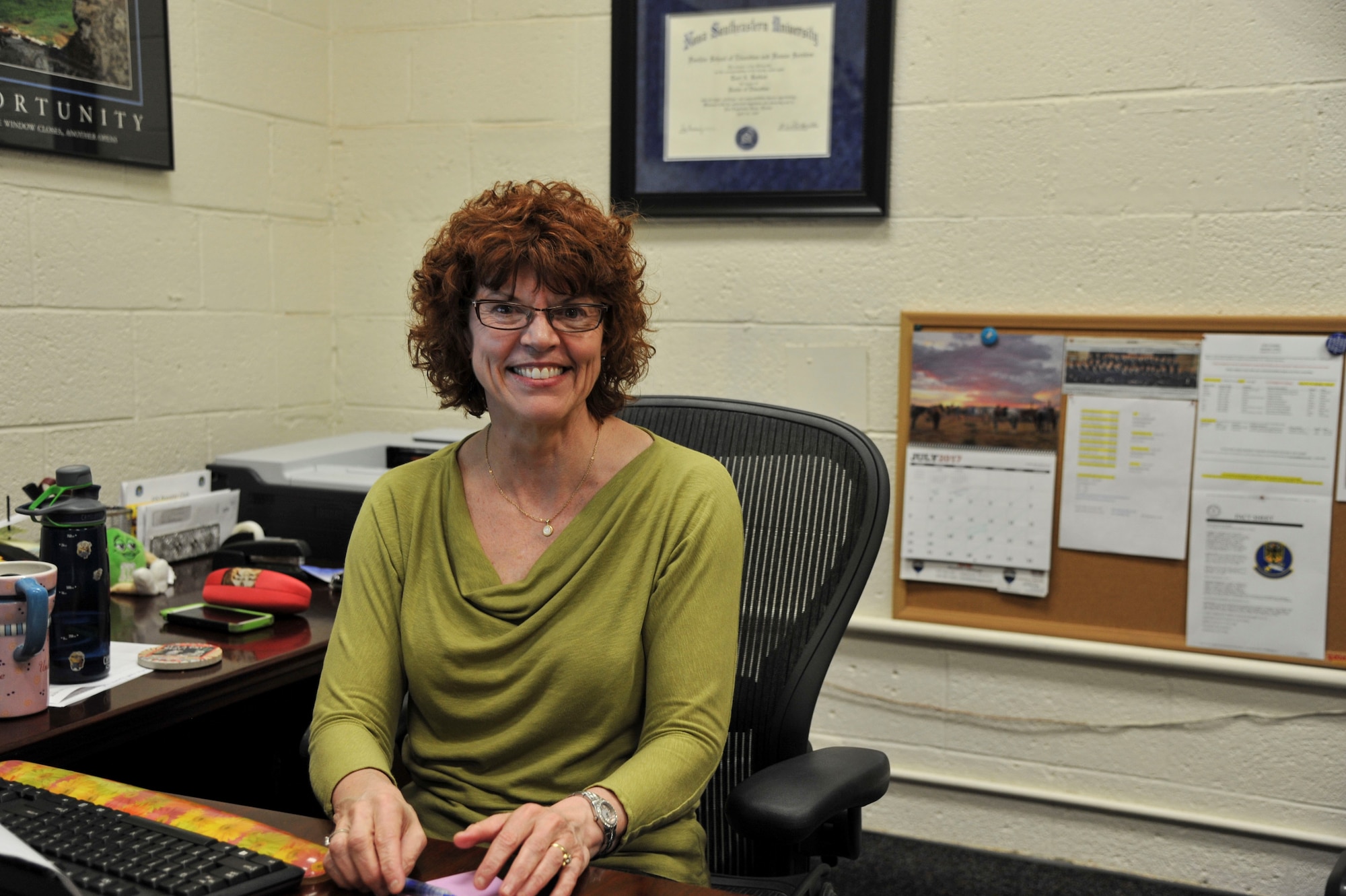 Terri Bedford, 377th Force Support Squadron education services supervisor’s job is to assist Airmen and families in deciding on their educational career path at the base education center on Kirtland Air Force Base, New Mexico, Aug. 1.  Aside from assisting Airmen and their families on deciding which educational goals they would like to achieve, the education center also offers handy self-help online resources. (U.S. Air Force Photo by A1C Alexandria Crawford)