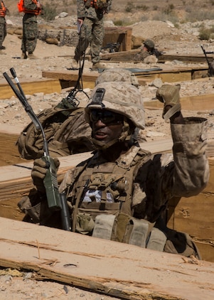 U.S. Marine Corps 1st Lt. Solomon S. Thomas, platoon commander with Echo Company, 2nd Battalion, 1st Marine Regiment, Marine Air-ground Taskforce-8 (MAGTF-8) gives an order while conducting Platoon hasty attack & maneuver range 410a during Integrated Training Exercise (ITX) 5-17 at Marine Corps Air Ground Combat Center, Twentynine Palms, Calif., July 22, 2017. The purpose of ITX is to create a challenging, realistic training environment that produces combat-ready forces capable of operating as an integrated MAGTF. (U.S. Marine Corps Photo by Cpl. Justin M. Smith)