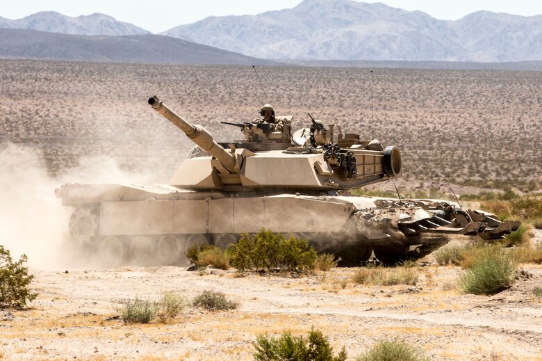 A U.S. Marine Corps M1A1 Abrams main battle tank with 1st Tank Battalion, Marine Air Ground Task Force-8 (MAGTF-8) maneuvers to the next objective while conducting a Tank Mechanized Assault Course (TMAC) during Integrated Training Exercise (ITX) 5-17 at Marine Corps Air Ground Combat Center, Twentynine Palms, Calif., July 28, 2017. The purpose of ITX is to create a challenging, realistic training environment that produces combat-ready forces capable of operating as an integrated MAGTF. (U.S. Marine Corps Photo by Sgt. Kassie L. McDole)