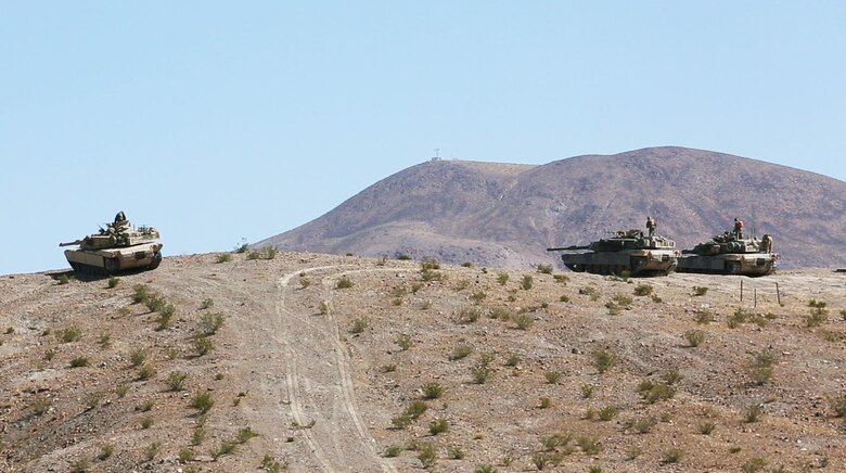 U.S. Marine Corps M1A1 Abram battle tanks with 1st Tank Battalion, Marine Air Ground Task Force-8 (MAGTF-8) scan for targets while conducting a Tank Mechanized Assault Course (TMAC) during Integrated Training Exercise (ITX) 5-17 at Marine Corps Air Ground Combat Center, Twentynine Palms, Calif., July 28, 2017. The purpose of ITX is to create a challenging, realistic training environment that produces combat-ready forces capable of operating as an integrated MAGTF. (U.S. Marine Corps Photo by Sgt. Kassie L. McDole)