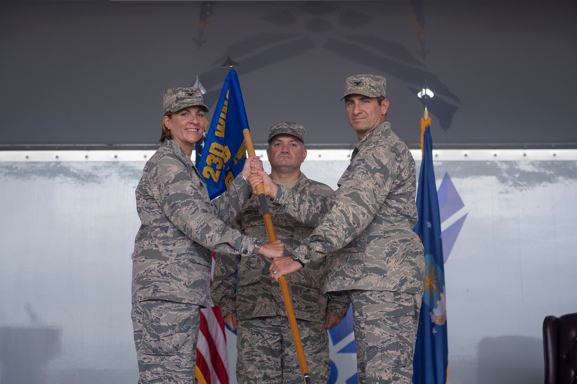 Col. Jennifer Short, 23d Wing commander, presents Col. John Chastain, incoming 23d Maintenance Group commander, with a guidon during an assumption of command ceremony, Aug. 3, 2017, at Moody Air Force Base, Ga. Chastain was formerly the commander of the 332d Maintenance Group, 332d Air Expeditionary Wing, Southwest Asia. (U.S. Air Force photo by Senior Airman Greg Nash)