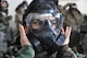 Senior Airman Tiana Chavez, 302nd Logistics Readiness Squadron, tests the seal on her gas mask air filter during pre-deployment training at Peterson Air Force Base, Colo., July 16, 2017. More than 150 Air Force reservists took part in the training, which included how to respond to an active shooter situation, the use of the chemical warfare mission oriented protective posture equipment, and an overview of self-aid buddy care in a combat environment. (U.S. Air Force photo/1st Lt. Stephen J. Collier)