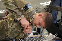 Senior Airman Spencer Prescott, 919th Special Operations Maintenance Squadron structural journeyman, works on a sheet metal project