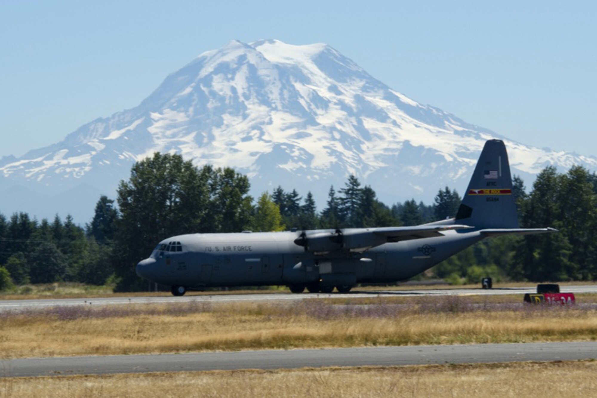 A U.S. Air Force C-130 Hercules with the 19th Airlift Wing, Little Rock Air Force Base, Ark., lands at Joint Base Lewis-McChord, Wash., July 31, 2017. More than 3,000 Airmen, Soldiers, Sailors, Marines and international partners converged on the state of Washington in support of Mobility Guardian. The exercise is intended to test the abilities of the Mobility Air Forces to execute rapid global mobility missions in dynamic, contested environments. Mobility Guardian is Air Mobility Command's premier exercise, providing an opportunity for the Mobility Air Forces to train with joint and international partners in airlift, air refueling, aeromedical evacuation and mobility support. (U.S. Air Force photo by Senior Airman Christopher Dyer)